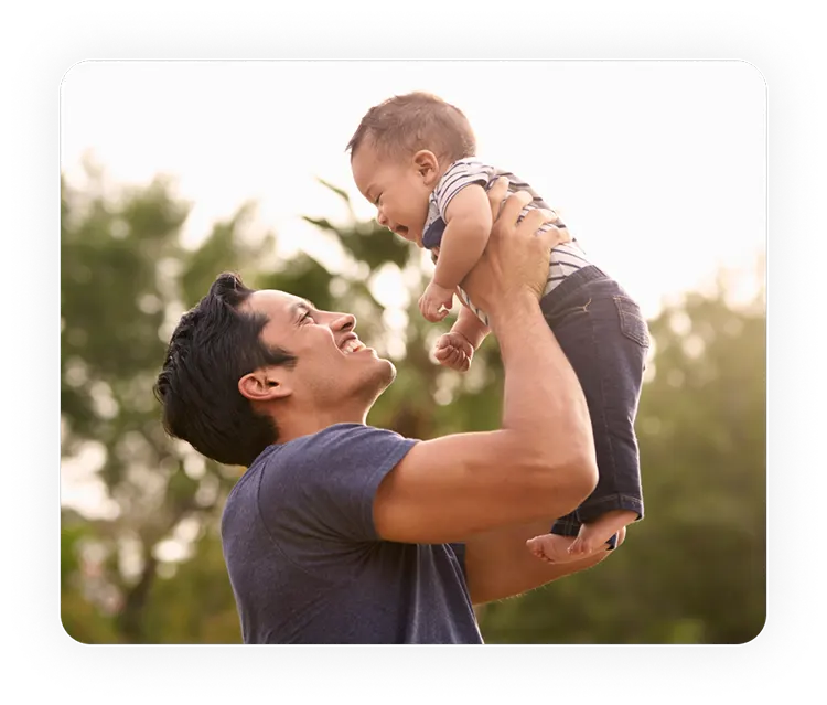 Young Father Holding Baby Happy